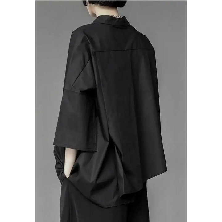 Black shirt with asymmetrical design and mid-length sleeves