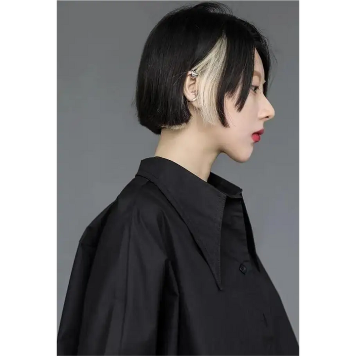 Black shirt with asymmetrical design and mid-length sleeves