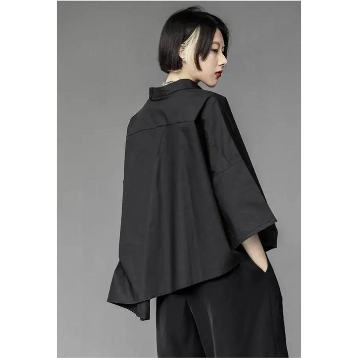 Black shirt with asymmetrical design and mid-length sleeves