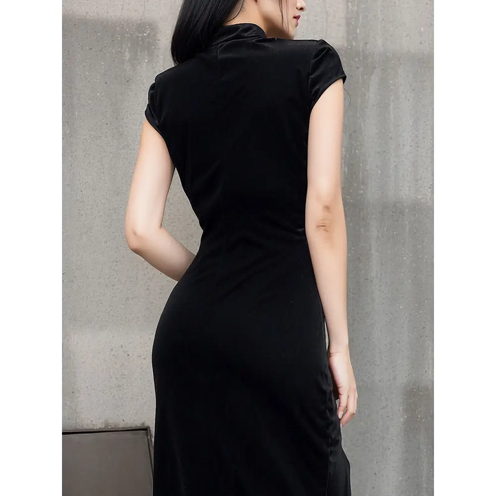 Gothic-inspired bodycon dress with slit hem for street style