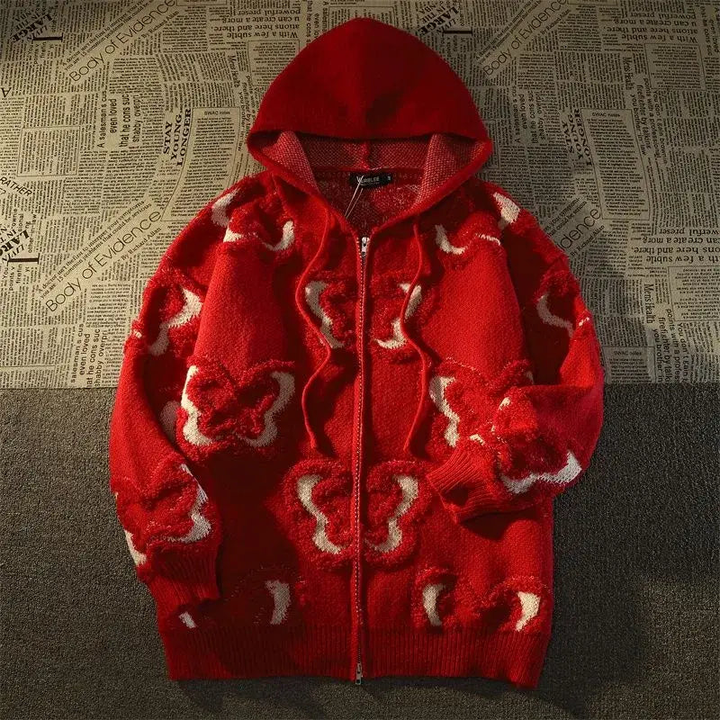 un pull rouge avec des cœurs blancs