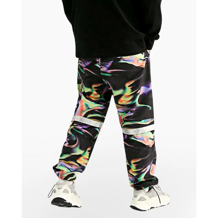 a man wearing a black sweatshirt and colorful pants