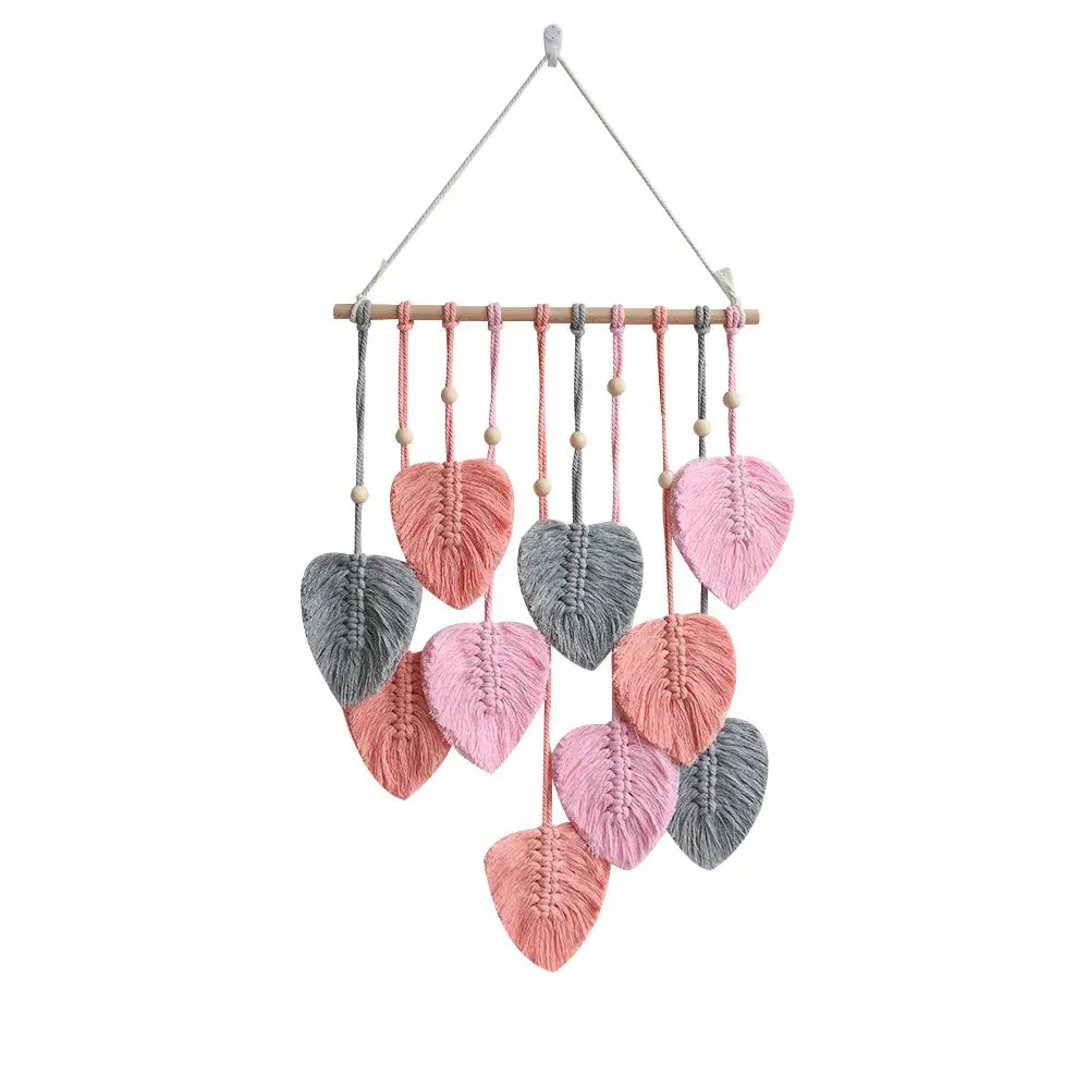 Rustic macrame wall hanging with intricate leaf design - pink