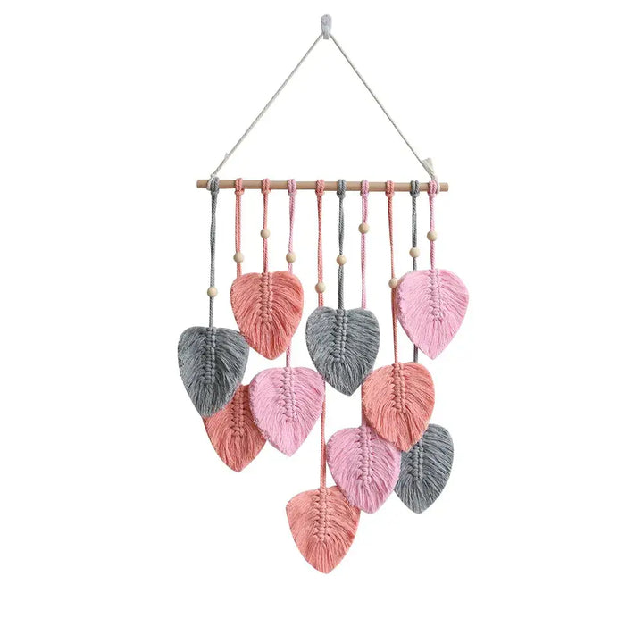 Rustic macrame wall hanging with intricate leaf design - pink