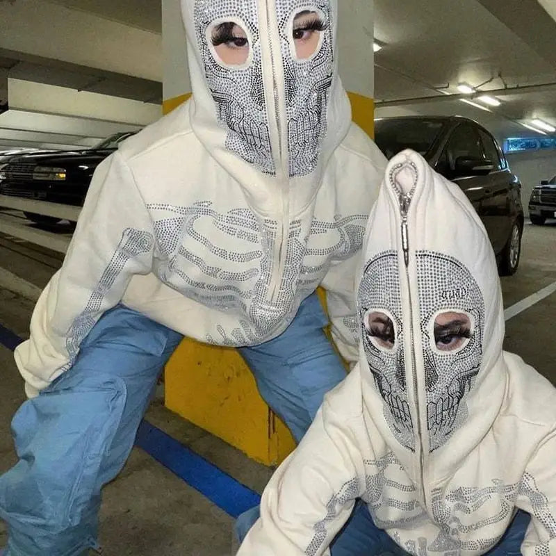 two people in white and blue outfits with white masks