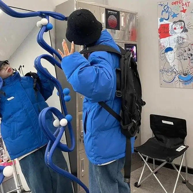 Y2k-inspired high-neck puffer with button fastening and twin pockets - jacket