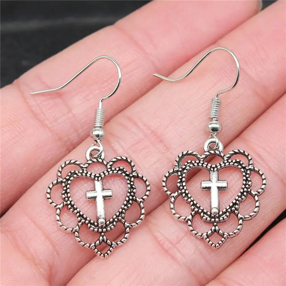 Y2k silver heart cross earrings for bold elegance