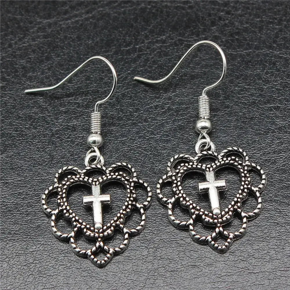 Y2k silver heart cross earrings for bold elegance