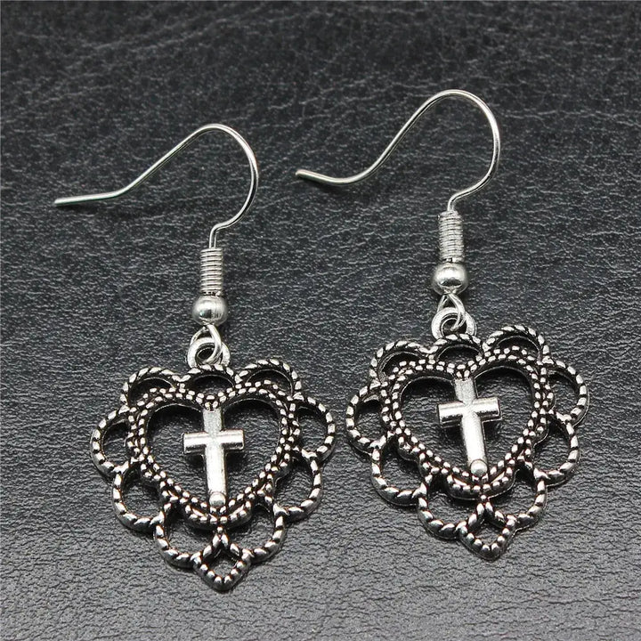 Y2k silver heart cross earrings for bold elegance