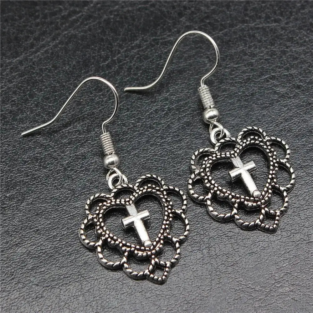 Y2k silver heart cross earrings for bold elegance