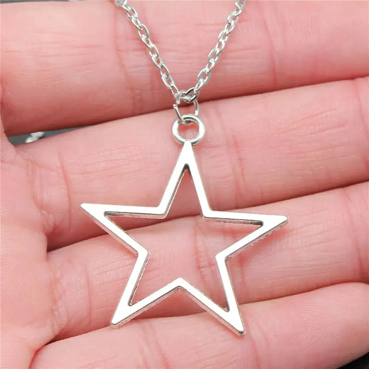 Geometric silver hollow star necklace with vintage charm - necklaces