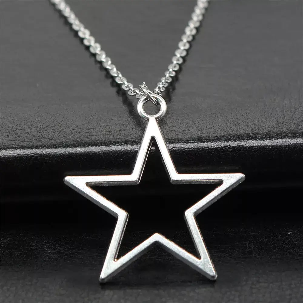 Geometric silver hollow star necklace with vintage charm - necklaces