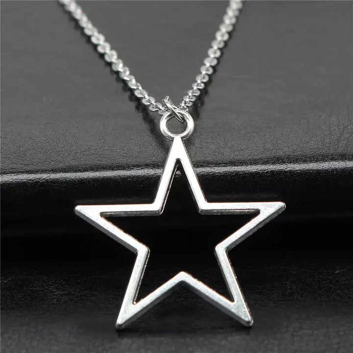 Geometric silver hollow star necklace with vintage charm - necklaces