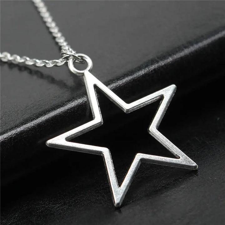 Geometric silver hollow star necklace with vintage charm - necklaces
