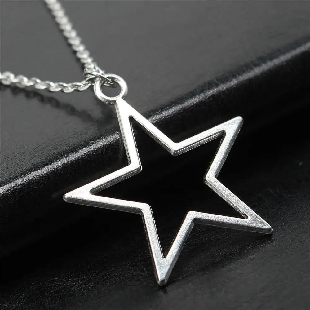 Geometric silver hollow star necklace with vintage charm - necklaces
