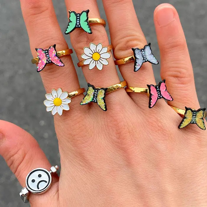 Y2k spinning emoji ring with sad and joyful smile design - ring