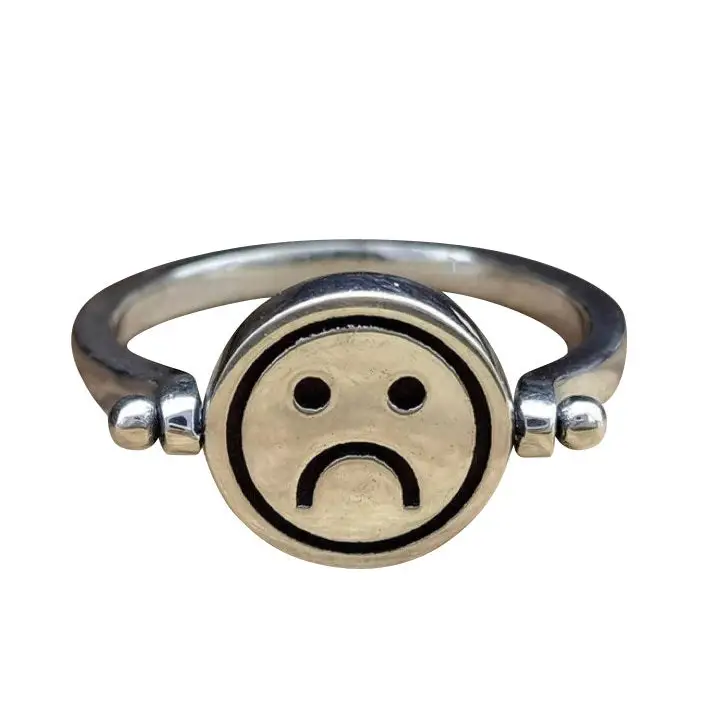 Y2k spinning emoji ring with sad and joyful smile design - ring