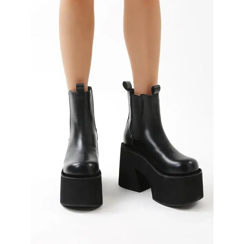 Y2k inspired chelsea boots with square heel and ankle height