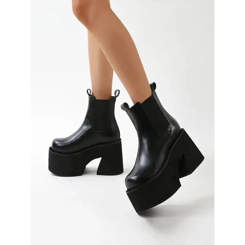 Y2k inspired chelsea boots with square heel and ankle height