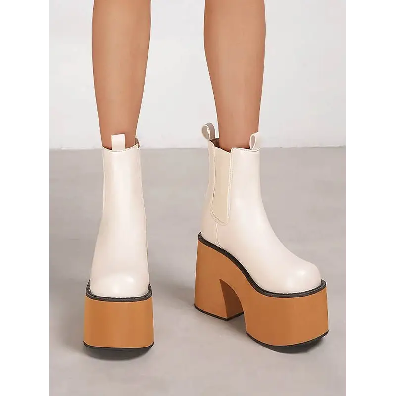 Y2k inspired chelsea boots with square heel and ankle height