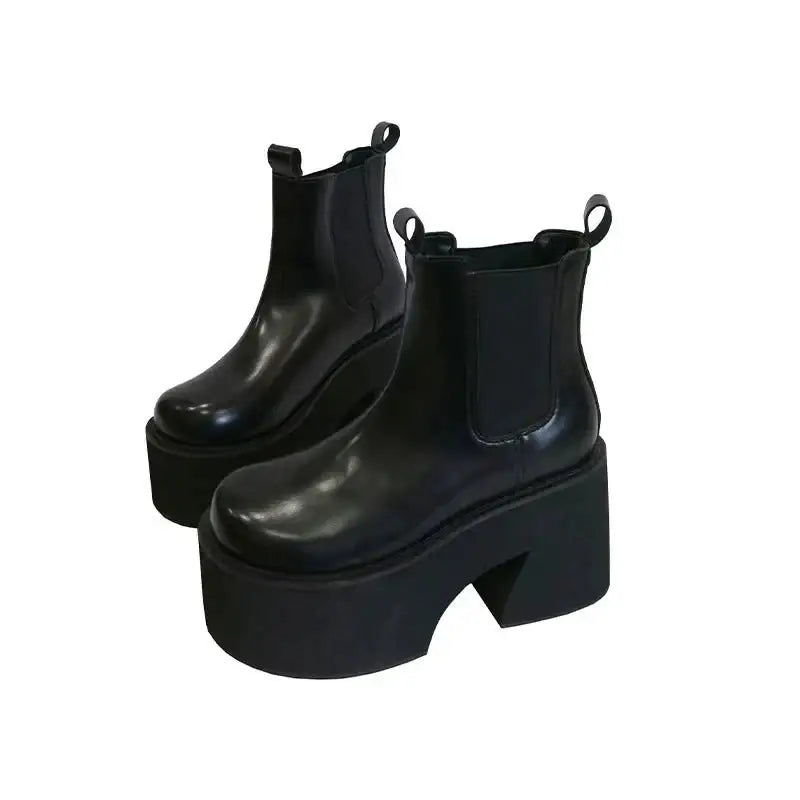 Y2k inspired chelsea boots with square heel and ankle height