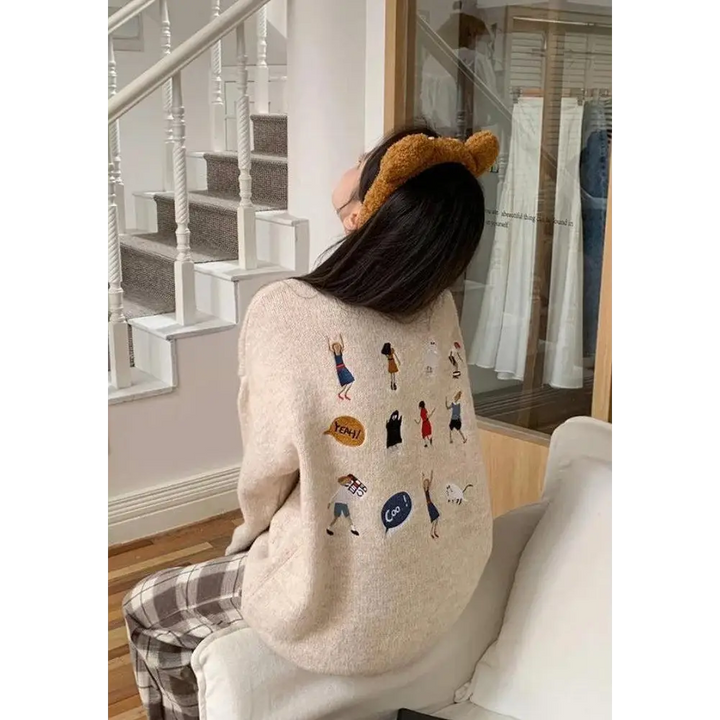 Cartoon embroidered knitted sweater with ripped details