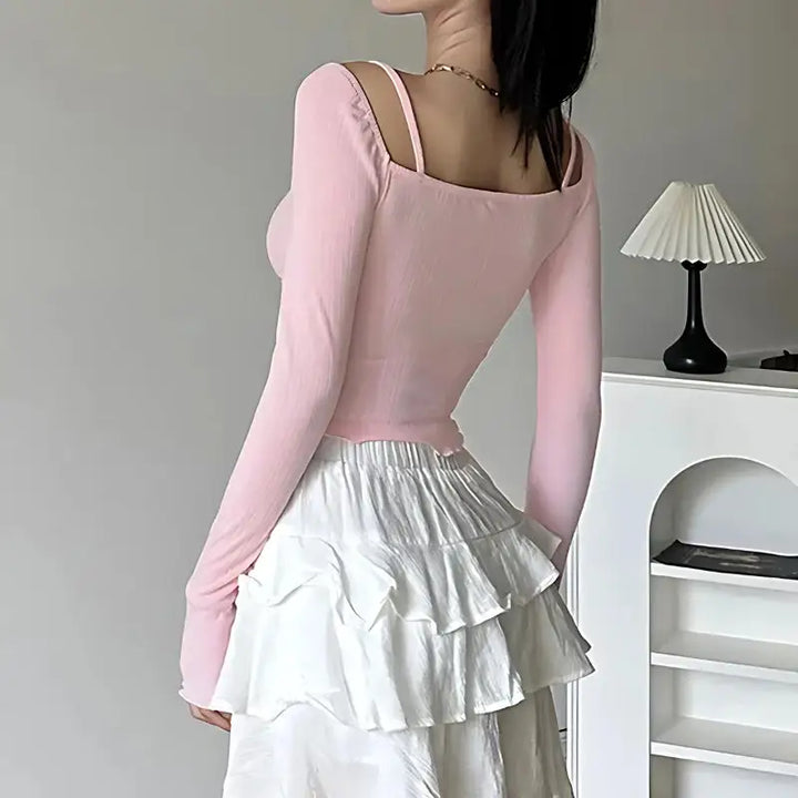 Soft pink jacket with bow straps and ruched detailing - top