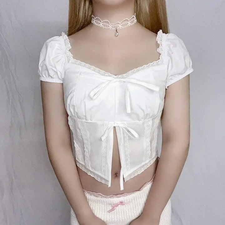 Elegant y2k crop top with puff sleeve and ribbon details