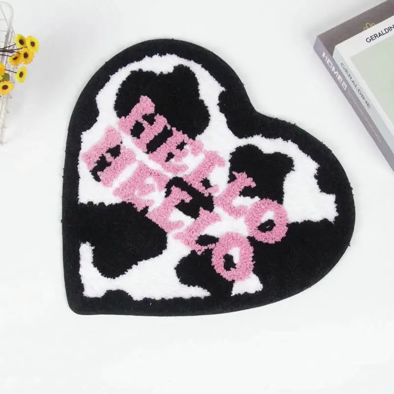 Cow print rug in heart shape for whimsical decor