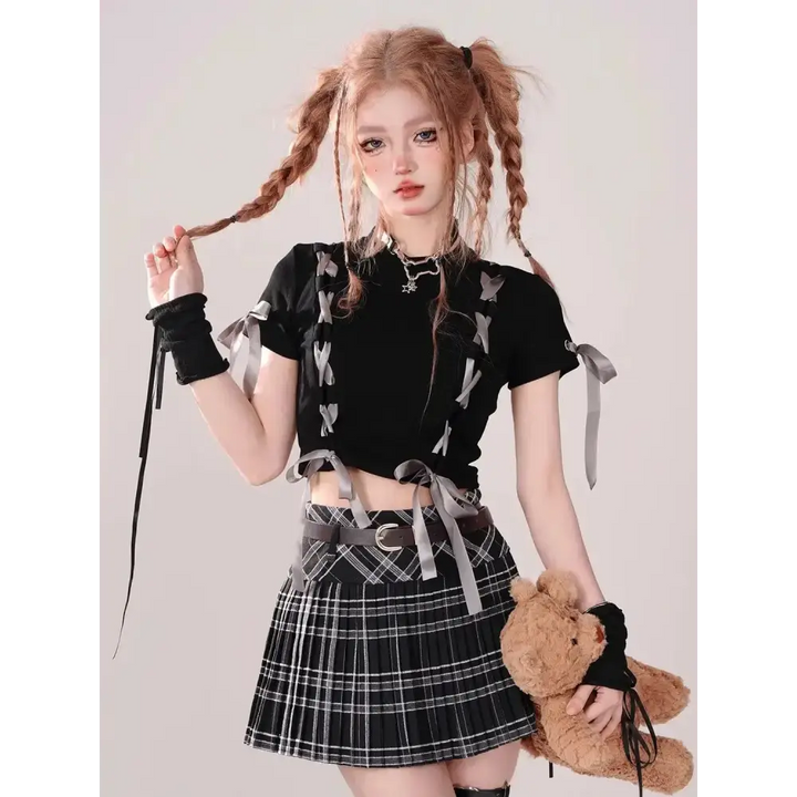 Black lace-up crop top for grunge coquette style