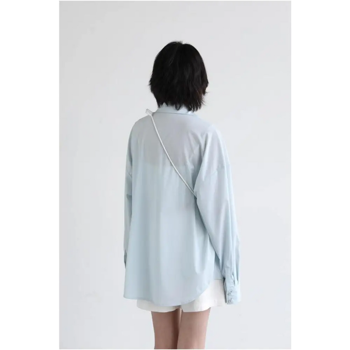 Light blue oversized poplin shirt with chest pocket in y2k style