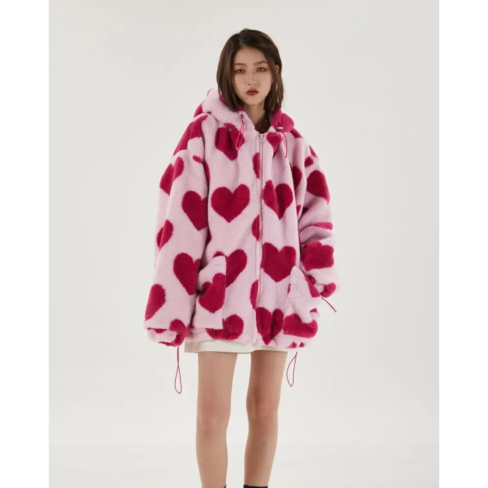 Pink hooded jacket with heart pattern and adjustable drawstring hood