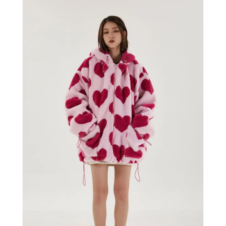 Pink hooded jacket with heart pattern and adjustable drawstring hood