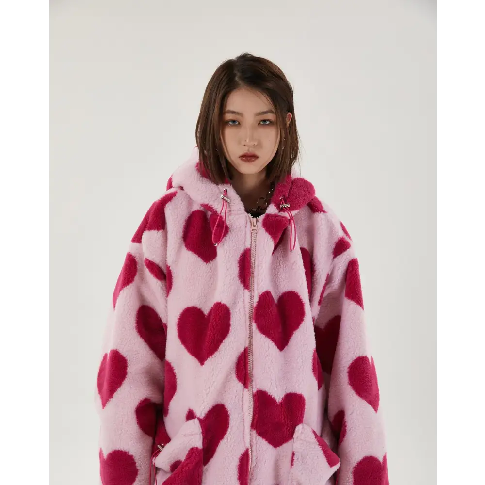 Pink hooded jacket with heart pattern and adjustable drawstring hood