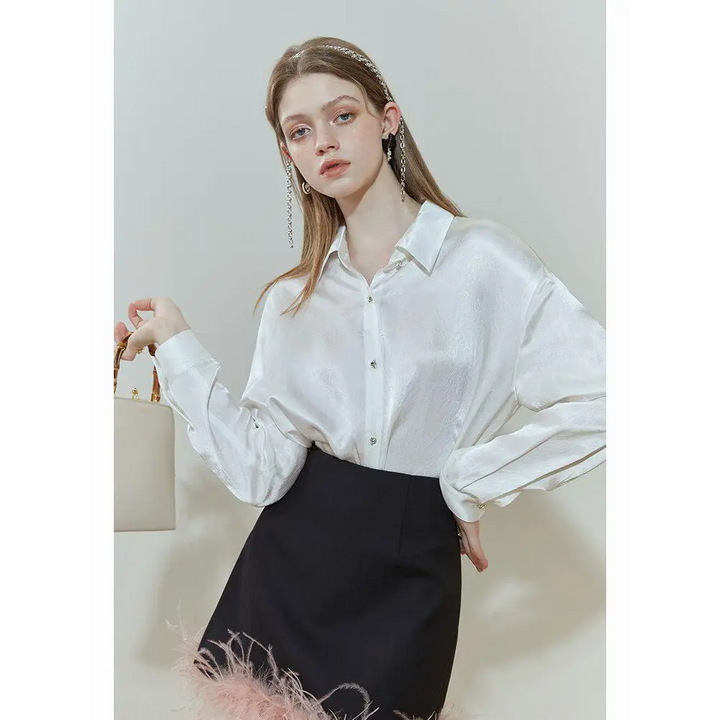 White satin blouse with classic collar and pure design