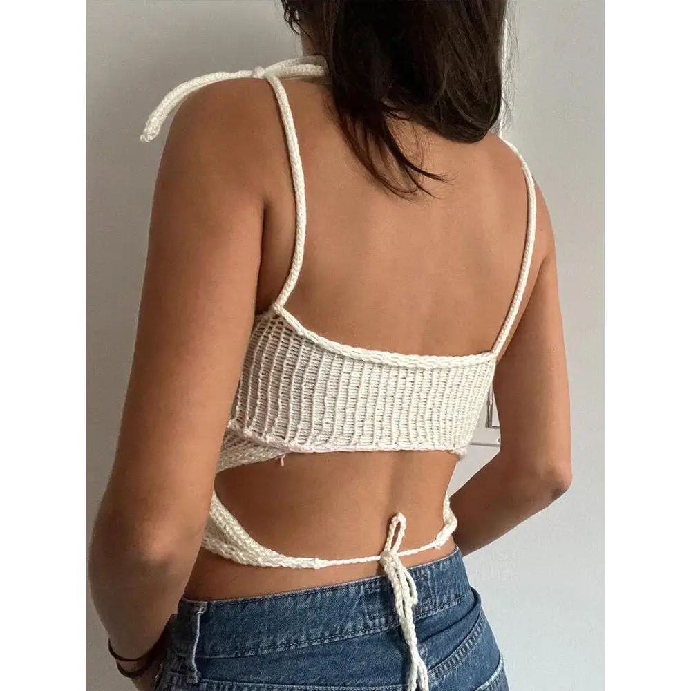 Ethereal white crop top with adjustable shoulder straps and knit rose details