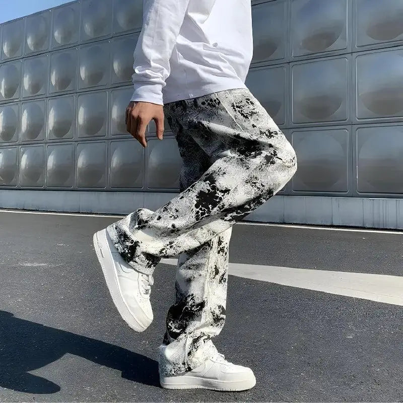 Y2k straight leg jeans in spray paint-inspired denim material - white / xs